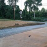 Small retaining wall and gravel spread